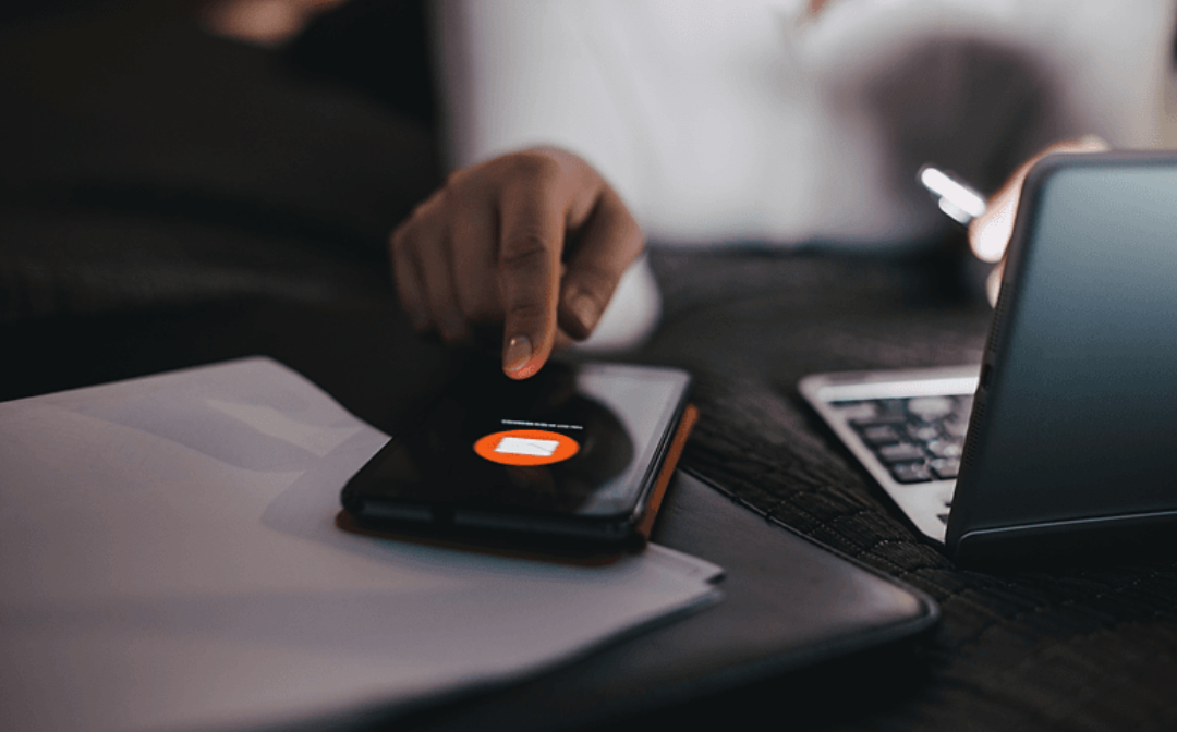 Business woman using and checking mobile phone