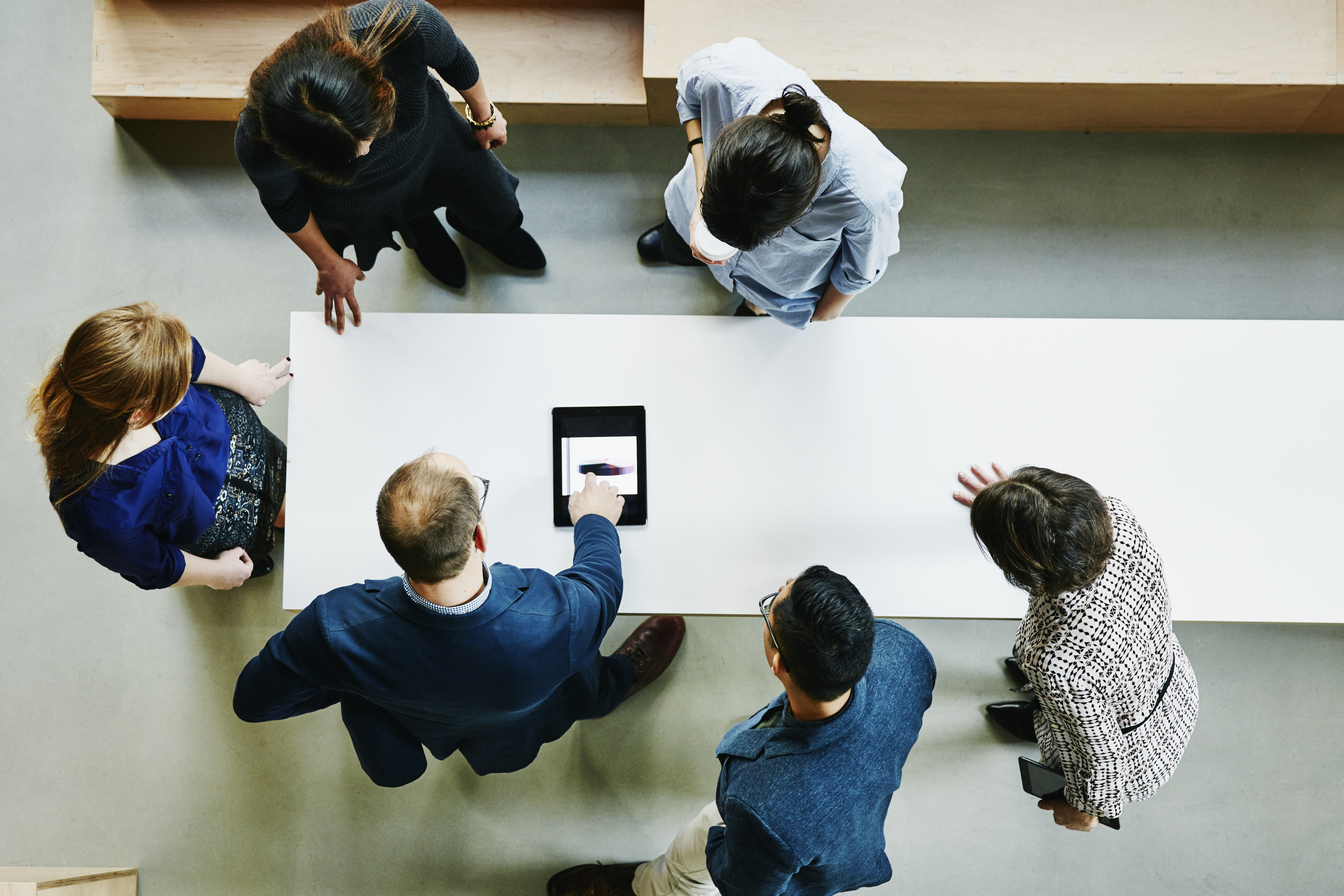 usiness colleagues discussing project in office